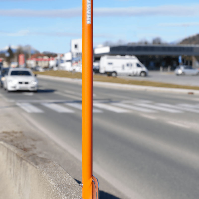 Metal and concrete barrier snow pole